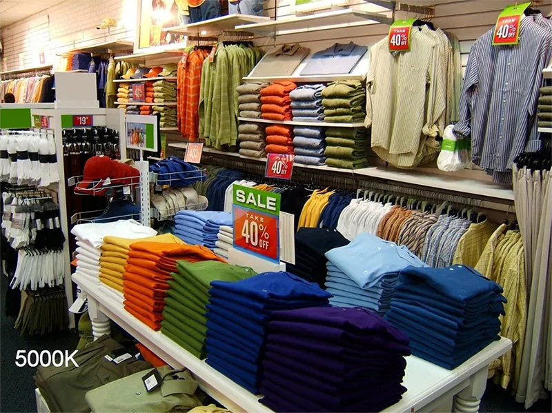Same retail store under full-spectrum lighting with accurate, natural color rendering