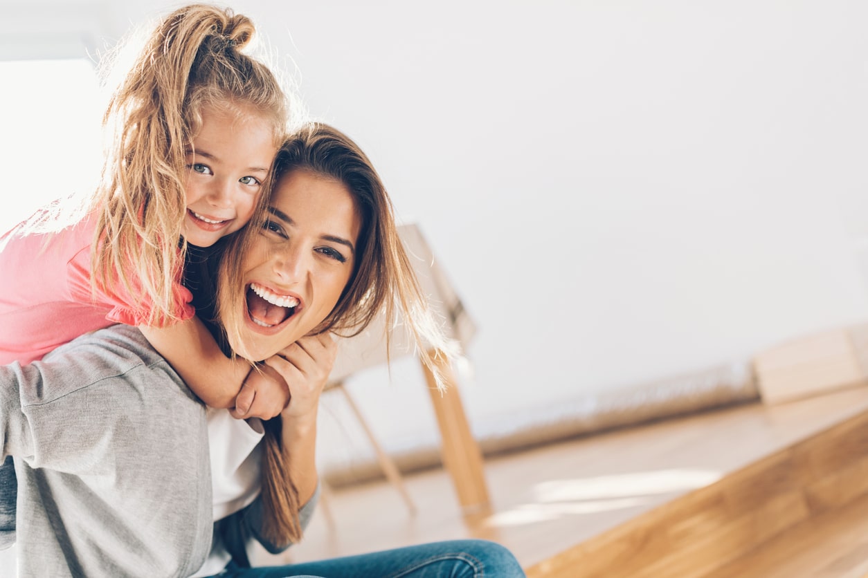 mother and daughter playing happily and enjoying their newly installed Full Spectrum Light Filters