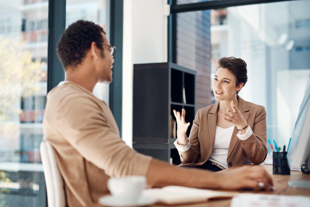 male-and-female-coworkers-having-meeting-discussion-in-office